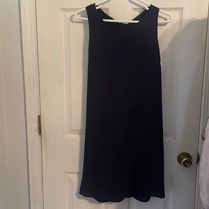 Collective Concepts T Back Shift Woven Dress. Large sizes. Color is navy blue.